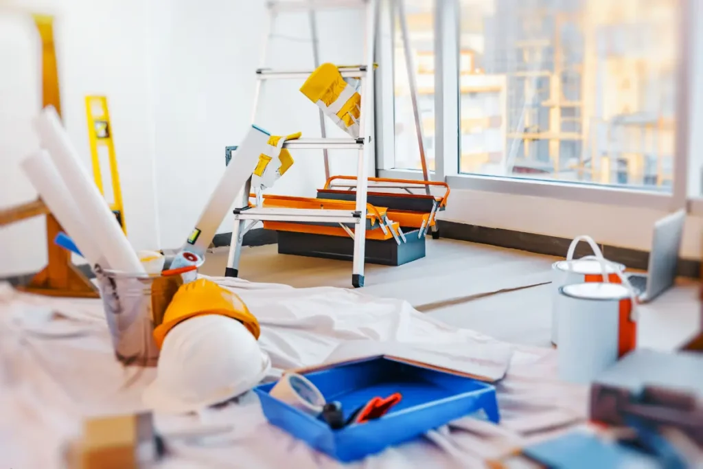 Job site with tools, hard hats, and ladders organized for efficient mobile equipment storage