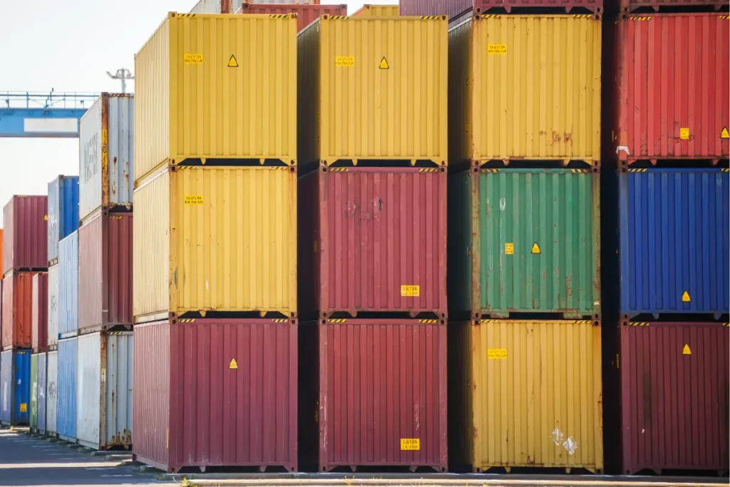 Onsite storage for construction highlighted by a worksite with stacks of lumber and blue packaging materials